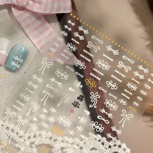 Stickers ongles 5D avec nœuds blancs et motifs floraux à texture en relief 3D
