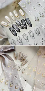 Detail of Gothic nail stickers featuring metallic gold and silver holy cross designs