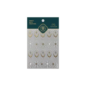 Gothic gold cross nail stickers with holy light patterns on dark green card packaging