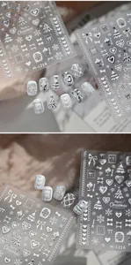 Detailed 3D embossed Christmas nail stickers featuring white trees, flakes and bows