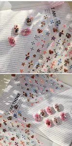 Detail of TL-432 nail stickers featuring gothic crosses, leopard print, and star patterns