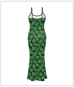 Detail of St. Patrick's Day maxi dress with green shamrock prints and plaid pattern