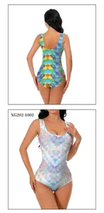 Detail of vibrant rainbow and pastel pink mermaid scale prints on high-elastic swimwear