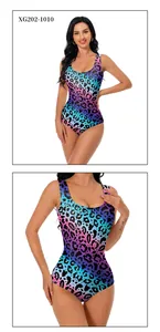 Detail of vibrant leopard print swimsuit with gradient blue and purple tones