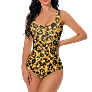 One-piece swimsuit with golden leopard print and shimmering sequin effect on white background