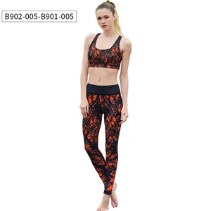 Detail showing orange and black abstract textured pattern on yoga sports bra and leggings