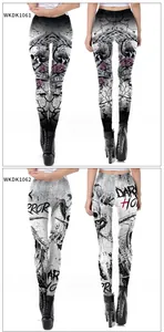 Detail view of gothic leggings with skull and floral patterns or horror theme prints