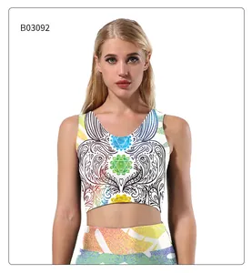 Close-up of vibrant mandala digital print on white crop top and athletic shorts set