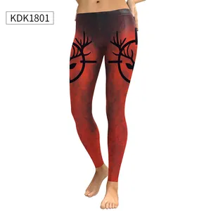 Detail of red and black gradient leggings featuring deer antler silhouettes and crackle print