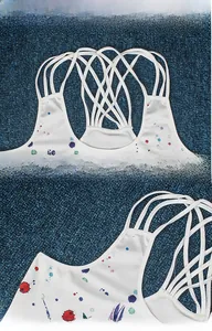 Detail of cross-back straps and multicolor digital skull print on a white camisole