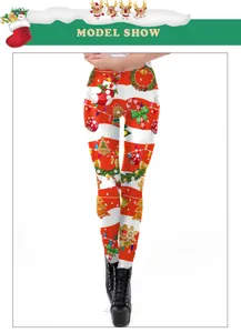 Detail of Christmas leggings featuring festive patterns on red and white striped fabric