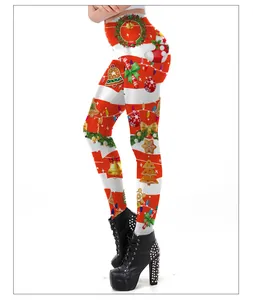Close-up of high-waist Christmas leggings with red stripes and holiday motifs