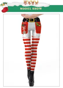Detail of Christmas leggings featuring Santa belt, red-white stripes and gift prints