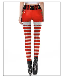 Detail of Santa Claus pattern leggings featuring red white stripes and candy cane prints