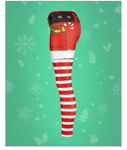 Detail of Christmas leggings featuring Santa belt print and red white striped pattern