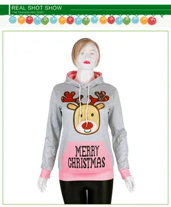 Detail of Christmas hoodie showing pink pocket with Merry Christmas text and deer print