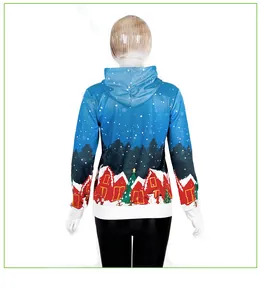 Back view of blue Christmas hoodie with snowy pine trees and red house prints