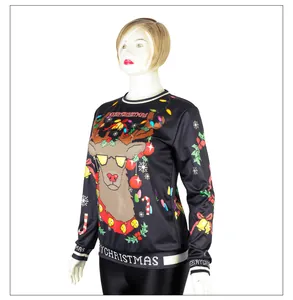 Detail of pixel reindeer print and Merry Christmas text on black crewneck sweatshirt