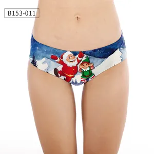 Detail of Christmas themed bikini underwear featuring Santa Claus print on blue fabric