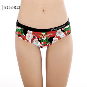 Close-up of women's Christmas panties featuring Santa Claus prints and Merry Christmas waistband
