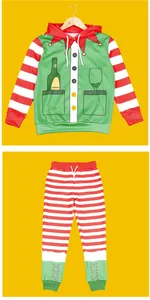 Detailed view of Christmas kids hoodie and joggers with festive elf print and red stripes