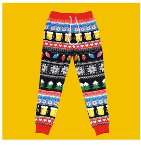 Close-up of black Christmas jogger pants with reindeer and festive pixelated holiday patterns