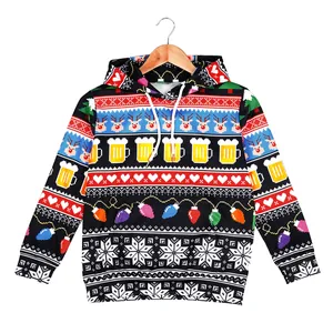 Christmas hoodie with reindeer and snowflake pixel print on a wooden hanger
