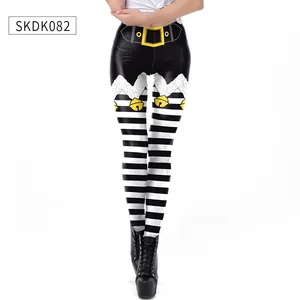Detailed view of Christmas leggings with festive belt print and black-white stripes