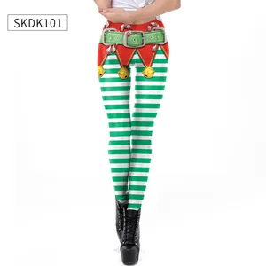 Detail of Christmas leggings featuring festive green stripes and printed elf belt motif