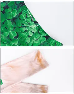 Primer plano del estampado de tréboles y la textura de la tela de los leggings de San Patricio