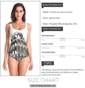 Detail view of white one-piece swimsuit featuring Leaning Tower of Pisa print and fabric info