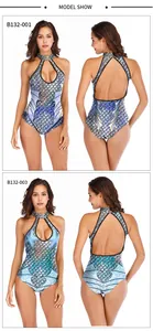 Detailed views of halter neck one-piece swimsuits with vibrant mermaid scale patterns
