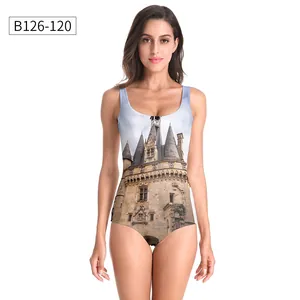 Detailed close-up of a one-piece swimsuit featuring a vintage European castle photo print