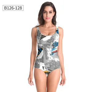 Close-up of industrial graffiti print and elastic fabric on a one-piece swimsuit