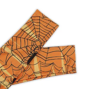Halloween high-stretch orange leggings featuring black spider web and spider prints