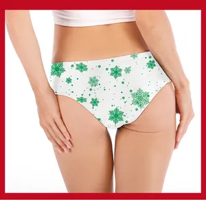 Detail of white Christmas panties with green snowflake print on a model from behind