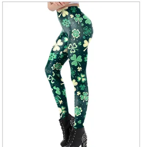 Detail of high-elastic St. Patrick's Day leggings with green shamrock prints and black boots