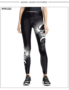 Detailed view of high waist black yoga leggings with mystic sun and eye prints