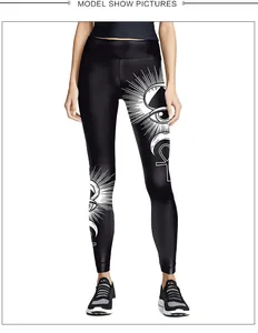 Detail of high waist black yoga leggings with mystic sun and moon printed patterns