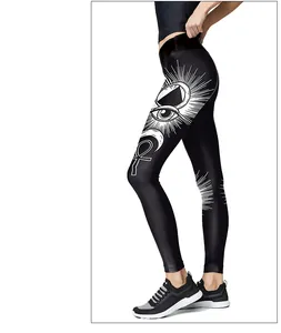 Close-up of black sports leggings featuring white Ankh and eye prints on the side