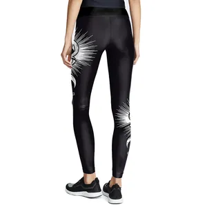Women's high waist yoga leggings with white mystical eye and moon art prints on black fabric