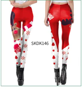Detail of red and white Christmas leggings featuring reindeer and snowflake prints