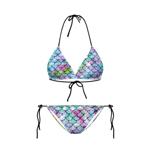 Detail view of mermaid scale print bikini set with adjustable black side ties and gradient colors