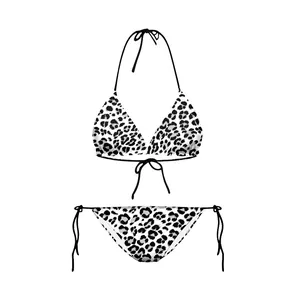 Detail of white and black leopard print bikini set with triangle top and side-tie bottom