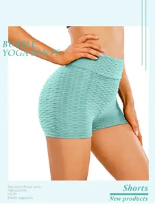 Detail of mint green yoga shorts featuring hip lift design and high elasticity bubble texture