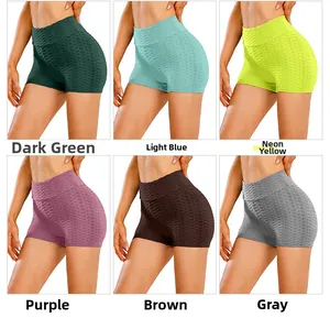 Detail view of honeycomb texture yoga shorts in dark green, blue, purple and grey colors