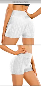 Detailed macro view of white honeycomb texture and ruched butt lifting seam on sports shorts
