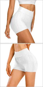 Close-up of white high-waisted yoga shorts featuring honeycomb texture and lifting design