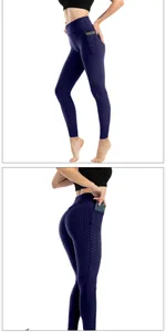 Dettaglio dei leggings yoga blu scuro a nido d'ape con vita alta e tasca per telefono