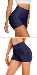 Detail of high-waisted navy blue scrunch booty yoga shorts with honeycomb texture fabric